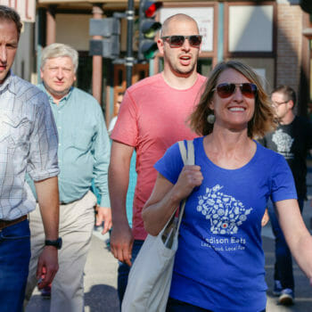 Food and Drink tour guide leading group on street