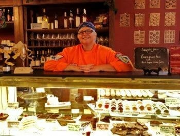 Server at Chocalatarian Cafe display counter