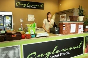 Cashier at counter of Englewood Local Foods