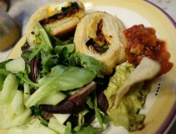 Plate of salad greens, salsa, and breakfast wraps