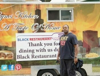 Owner standing in front of Haynes Kitchen food cart