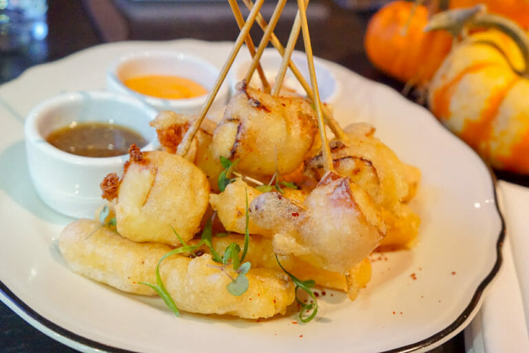 Bacon wrapped tempura cheese curds from Heritage