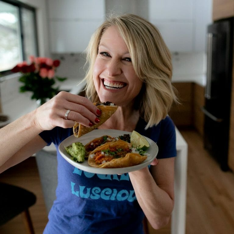 Otehlia Cassidy enjoying a trio of tacos from la Mestiza