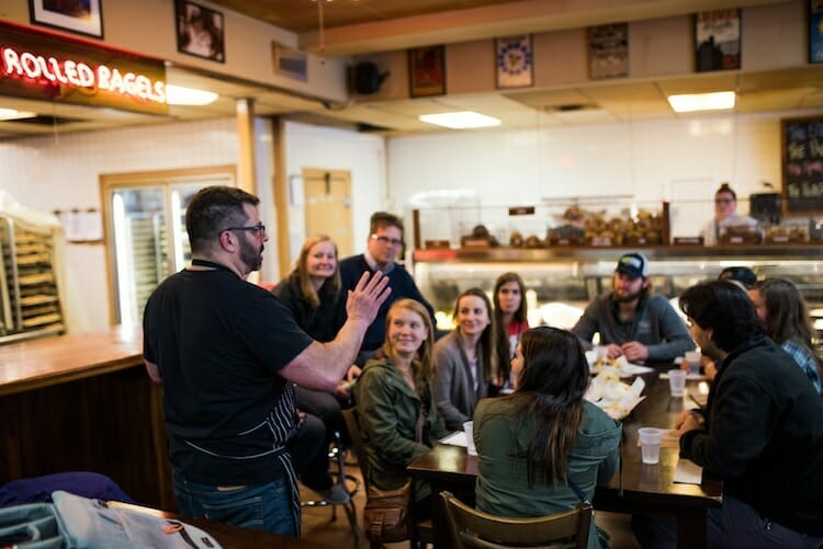 Food tour group at bagel shop