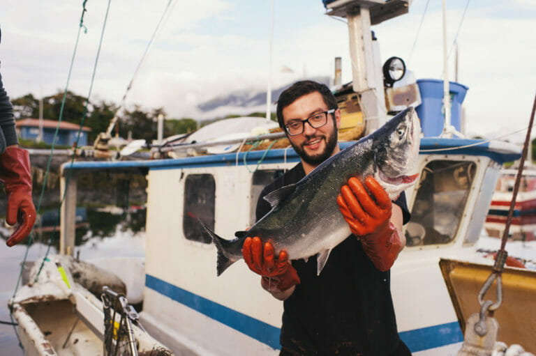 Photo of man holding a fish