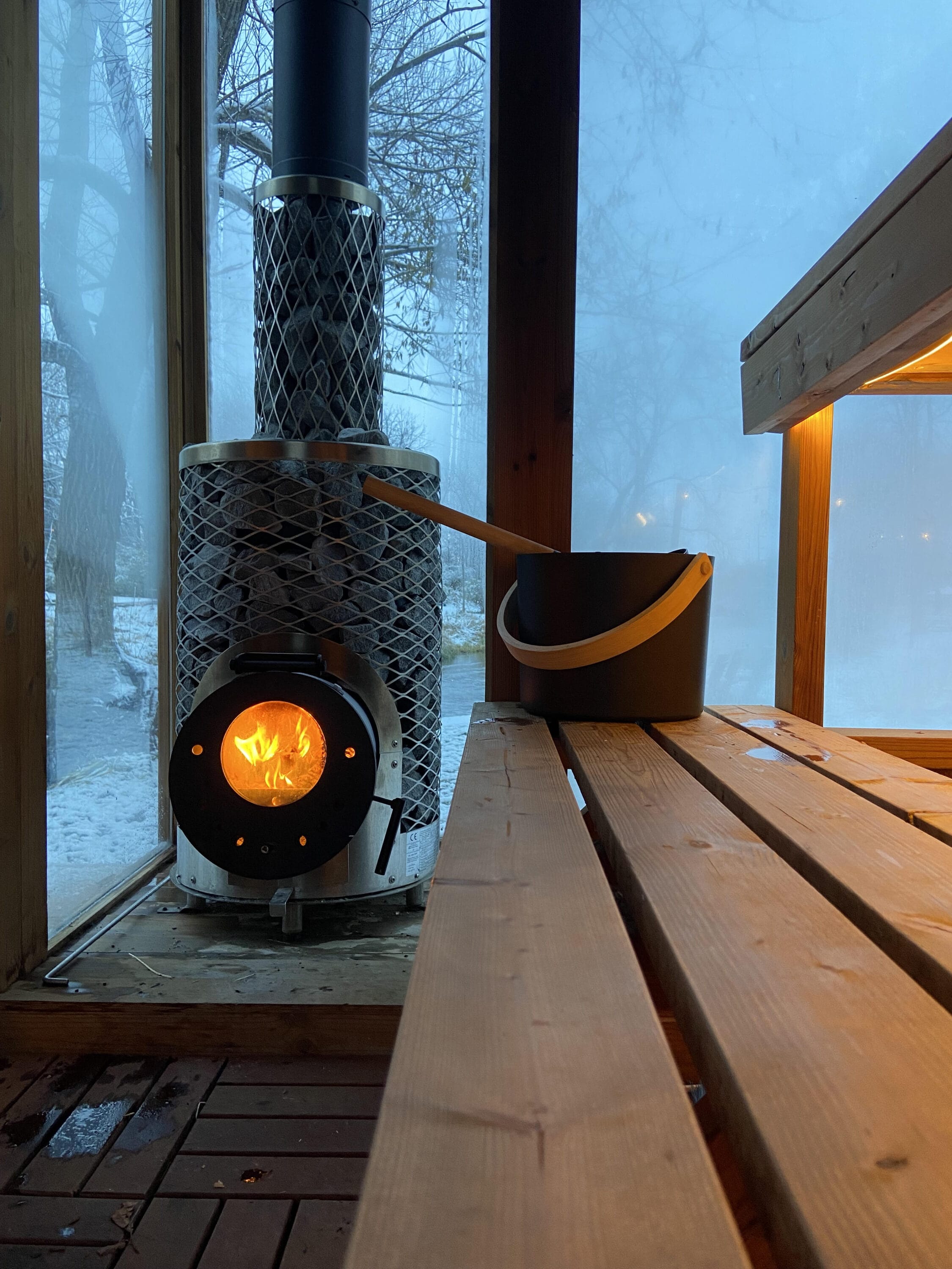 Out door sauna fire with snowy background