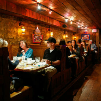 Restaurant patrons dining at booth