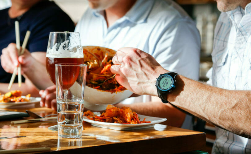 Guest dishing up food onto plate