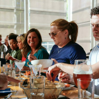 Food and Drink tour group dining at long table