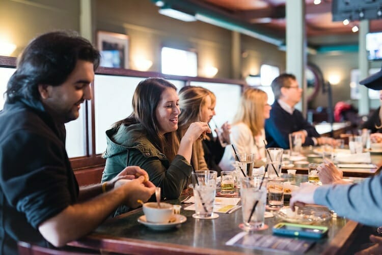 Tour group guests enjoying food and drinks