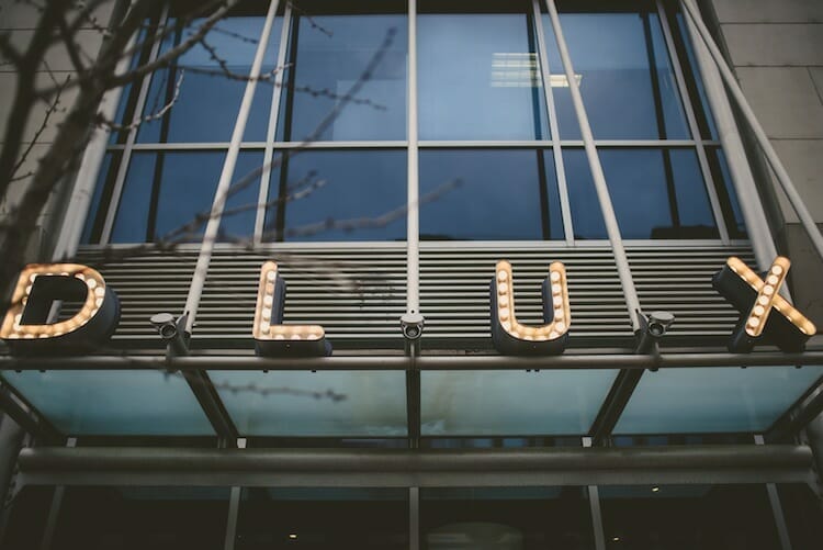 Front Dlux restaurant sign from food tour stop